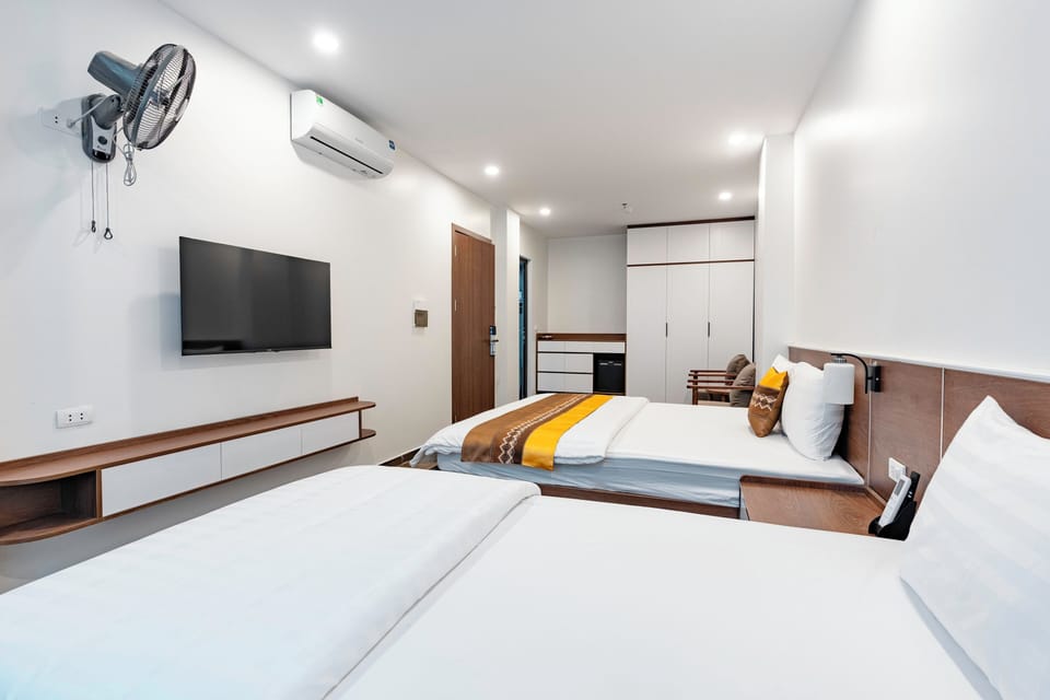 Family Quadruple Room, Non Smoking, City View | Premium bedding, down comforters, memory foam beds, in-room safe