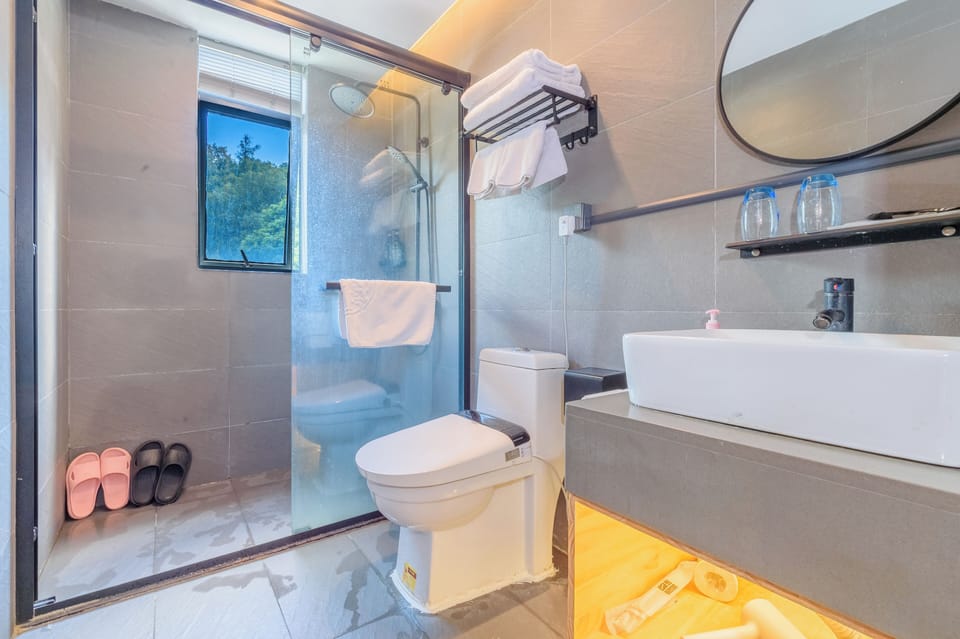 Shower, eco-friendly toiletries, hair dryer, slippers