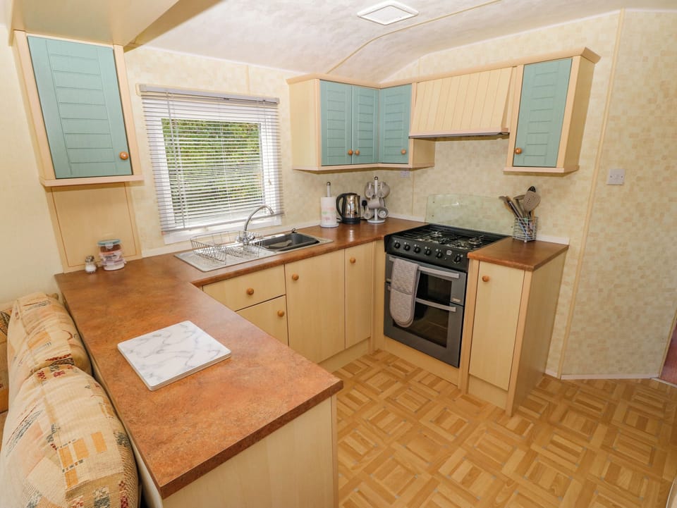 Fridge, electric kettle, toaster, cookware/dishes/utensils