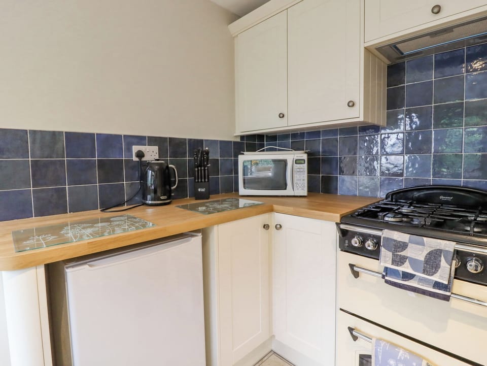 Fridge, electric kettle, toaster, cookware/dishes/utensils