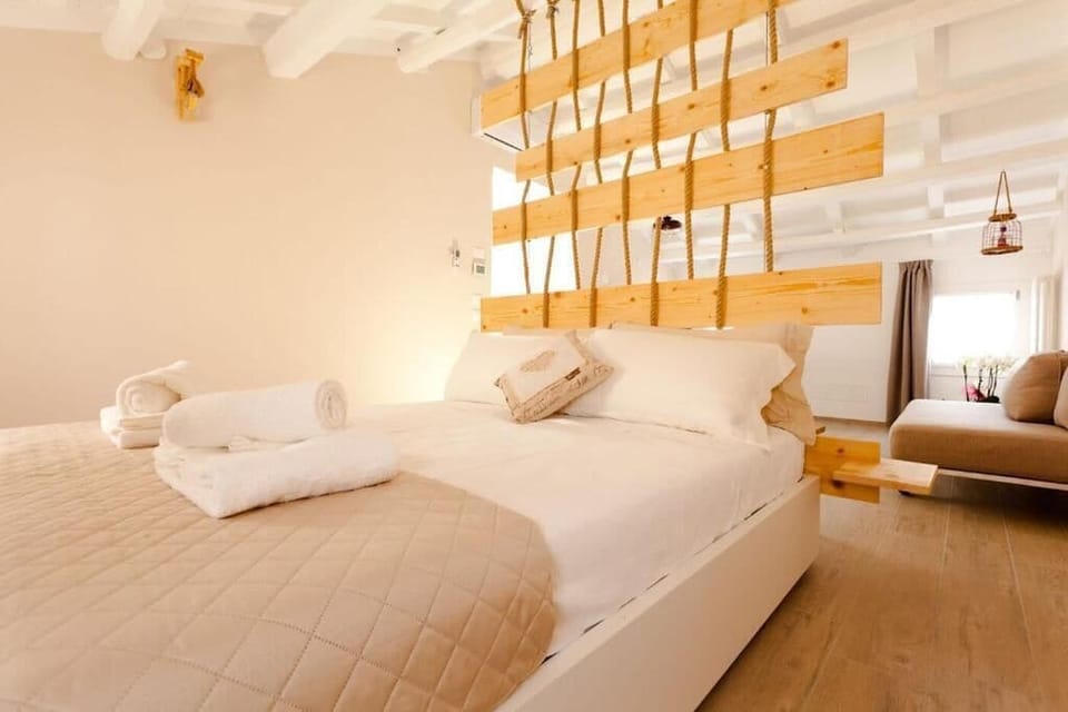 Deluxe Studio | Premium bedding, down comforters, blackout drapes, free WiFi