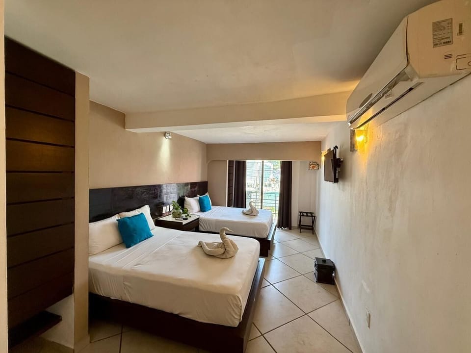 Deluxe Suite, 2 Queen Beds, Balcony, City View | 1 bedroom, minibar, WiFi (free)