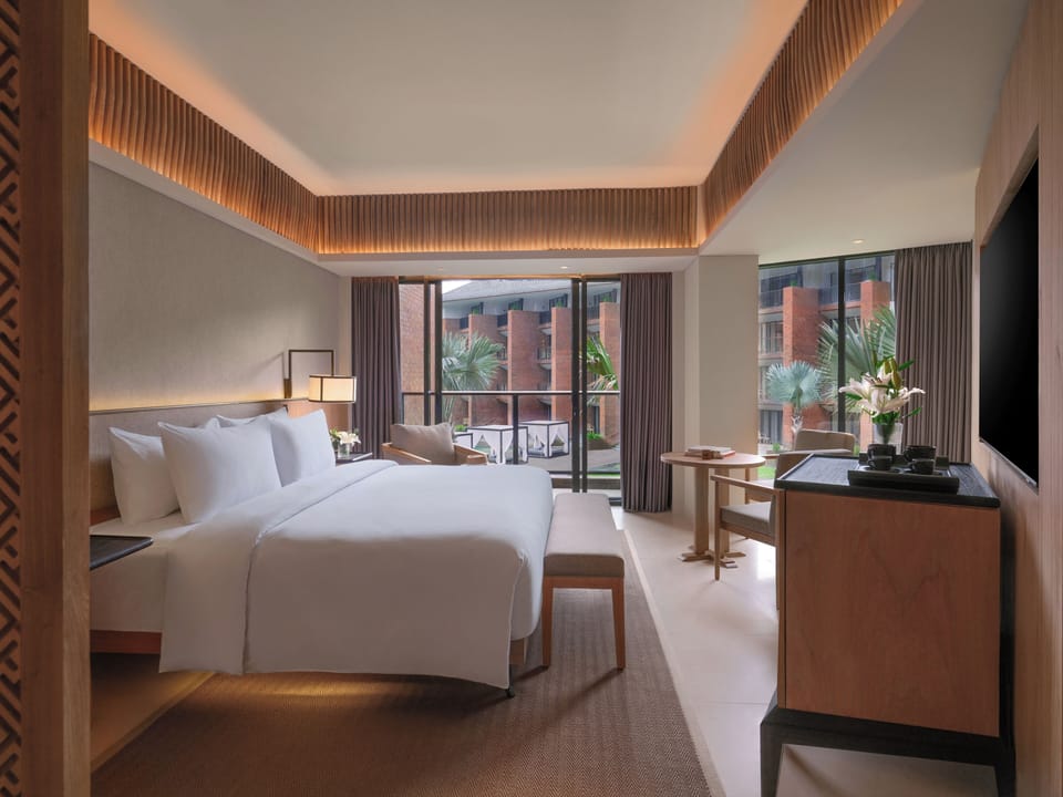 Grand Deluxe room, balcony and pool view - 1 king bed | In-room safe, desk, blackout drapes, soundproofing