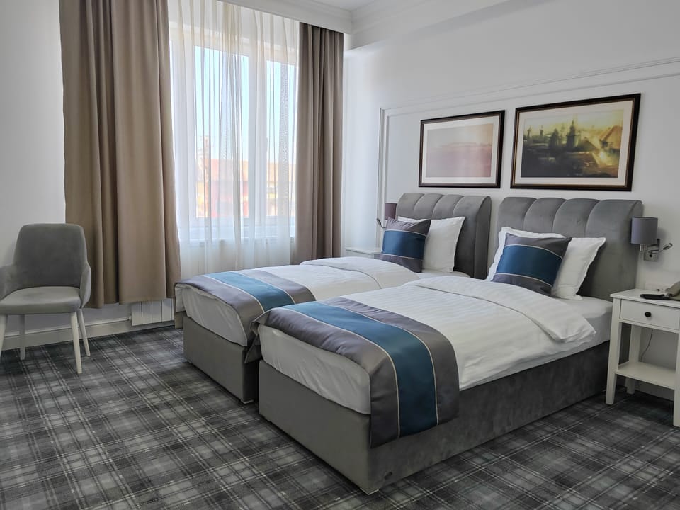 Standard Twin Room, City View | Desk, blackout drapes, soundproofing, travel crib