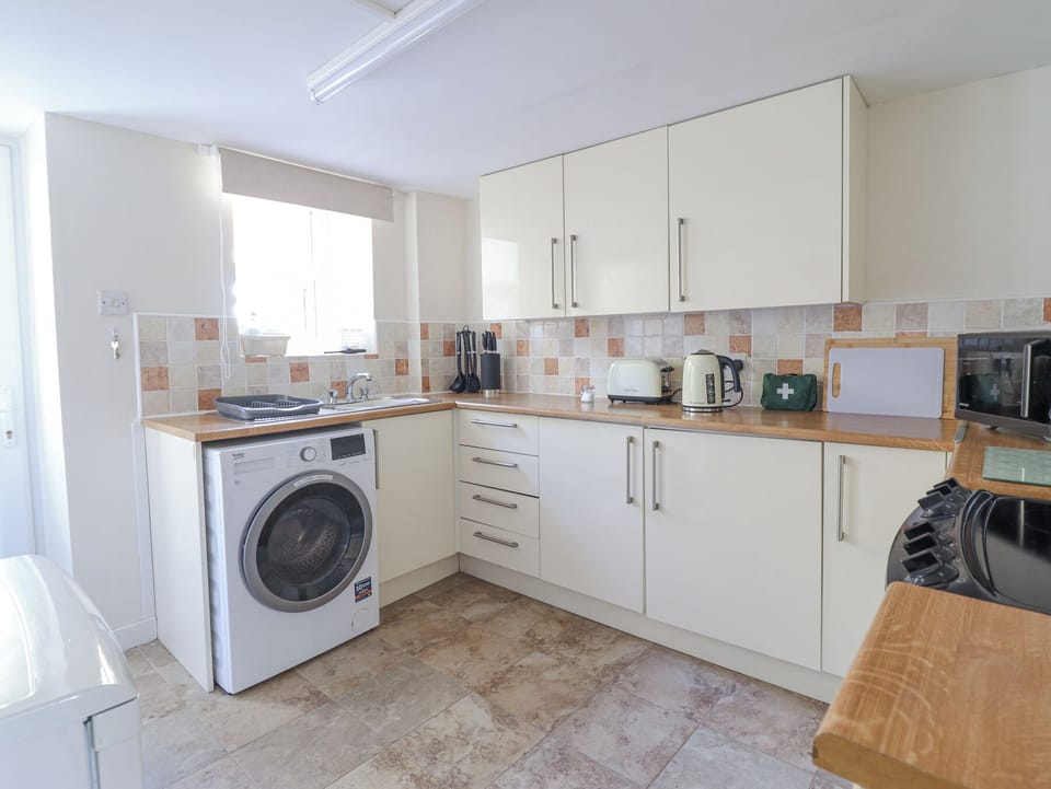 Fridge, microwave, toaster, cookware/dishes/utensils