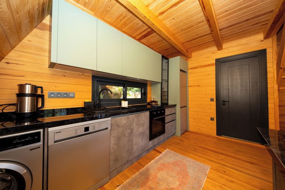 Apartment, Garden View | Private kitchen | Full-size fridge, oven, stovetop, dishwasher