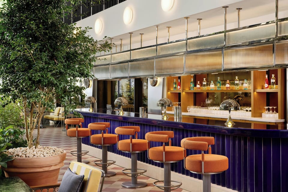 3 bars/lounges, lobby lounge, rooftop bar