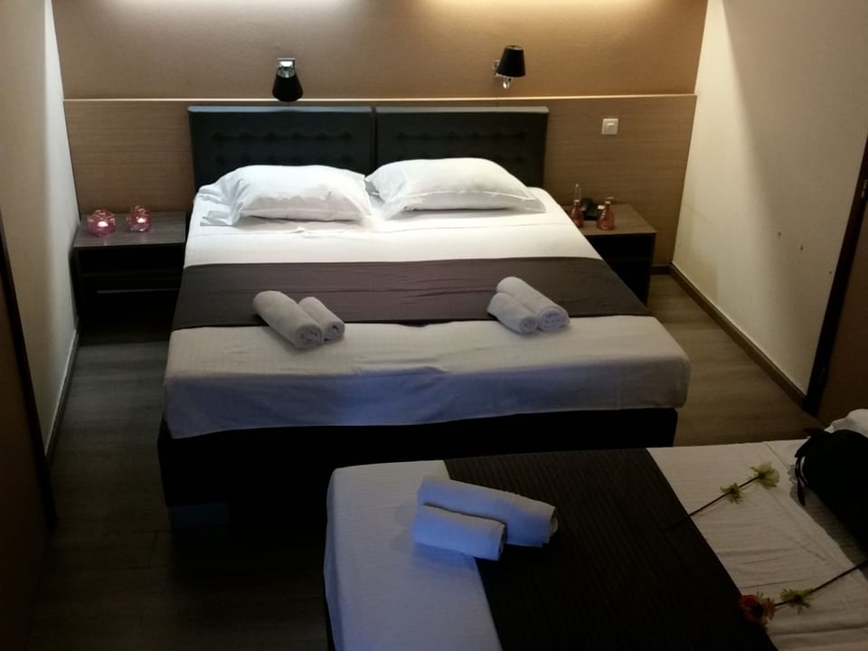 Quadruple Room | Premium bedding, in-room safe, individually furnished, desk