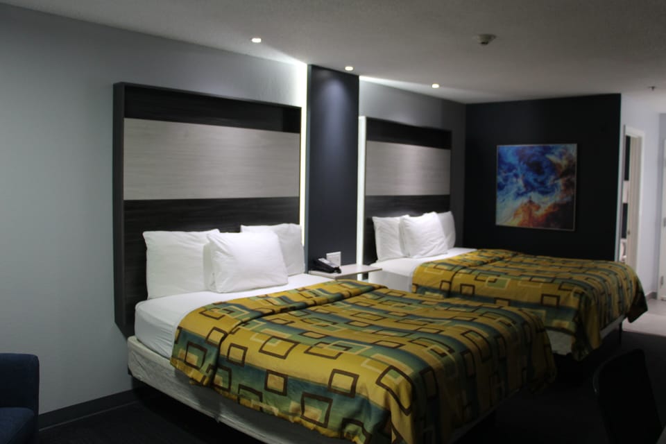 Deluxe Double Room | Desk, laptop workspace, blackout drapes, iron/ironing board