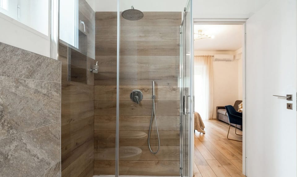 Quadruple Room | Bathroom | Shower, hair dryer, towels, soap