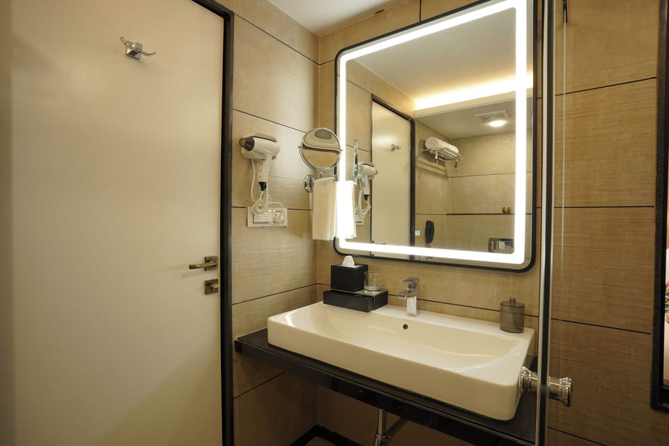 Executive Suite, City View | Bathroom | Shower, slippers, bidet, towels