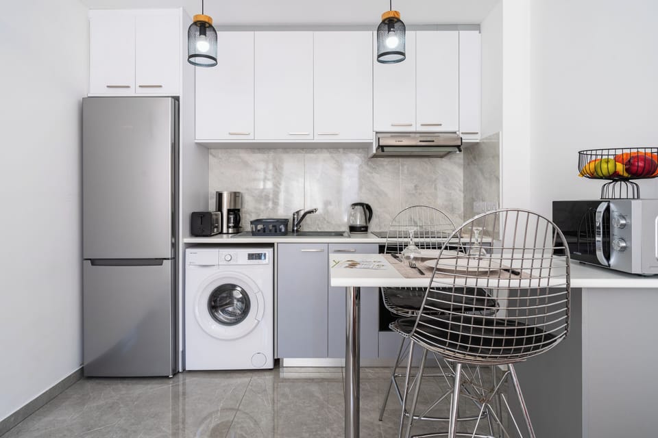 Apartment, 1 Bedroom, City View, Mezzanine | Private kitchen | Coffee/tea maker, full-size fridge, microwave, oven