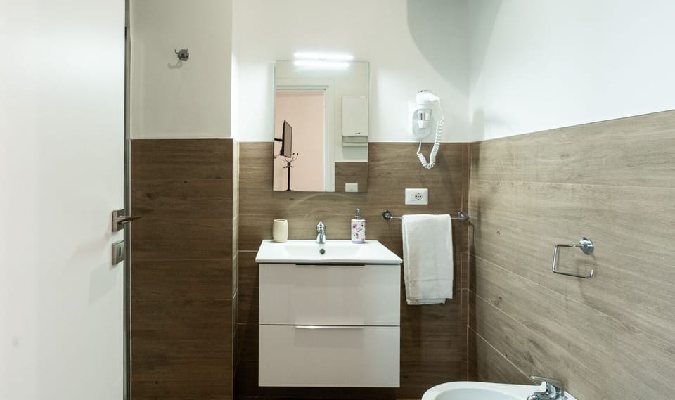 Quadruple Room | Bathroom | Shower, hair dryer, towels, soap