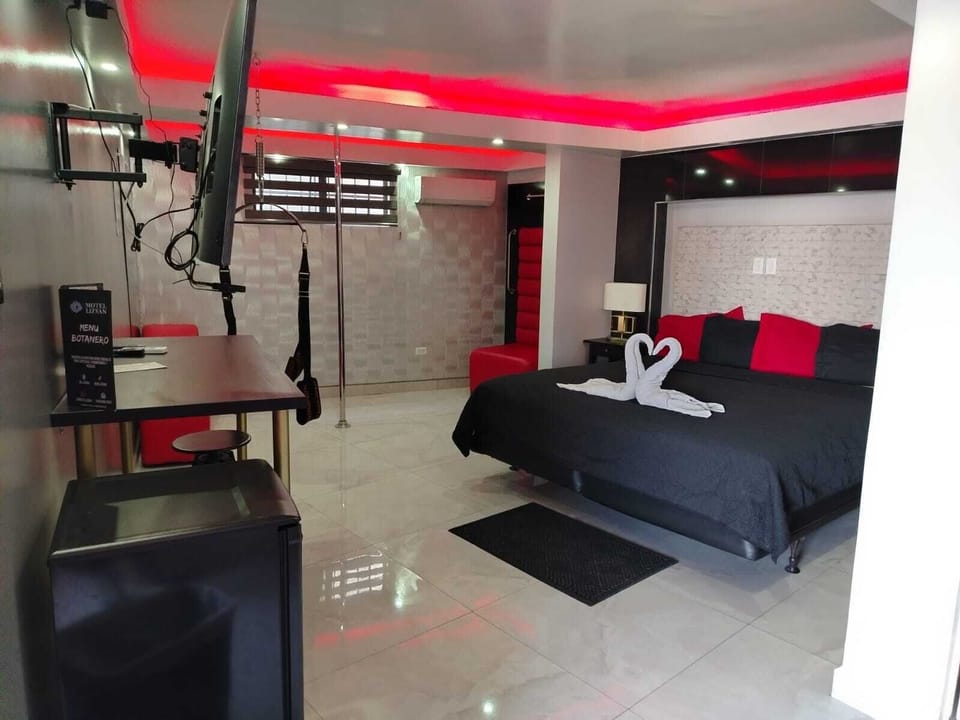 Deluxe Room, 1 Bedroom | Laptop workspace, blackout drapes, iron/ironing board, free WiFi