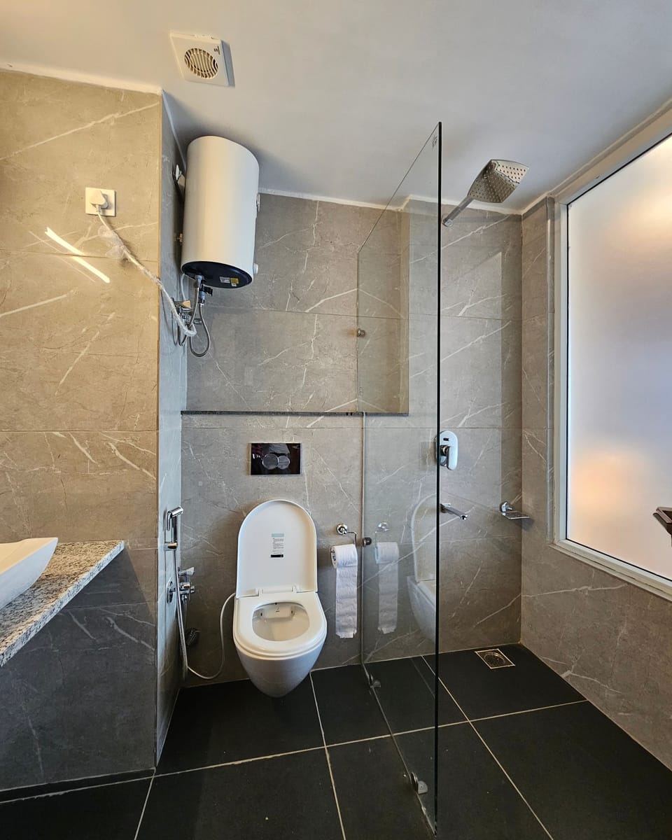 Combined shower/tub, free toiletries, hair dryer, slippers