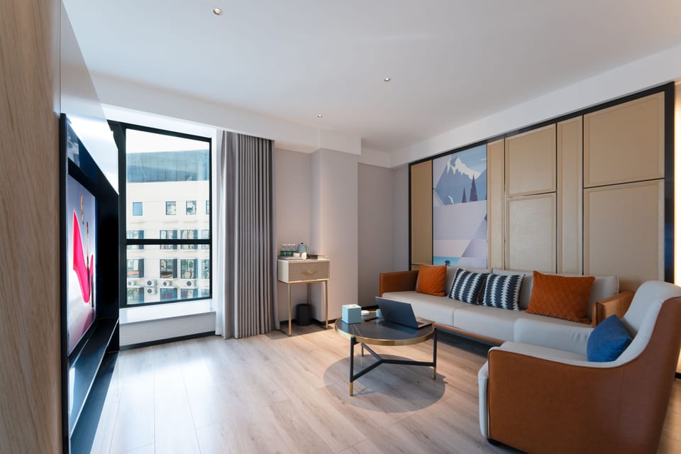 Premium bedding, desk, laptop workspace, blackout drapes