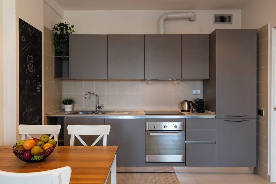 Deluxe Apartment | Private kitchen | Full-size fridge, oven, stovetop, dishwasher