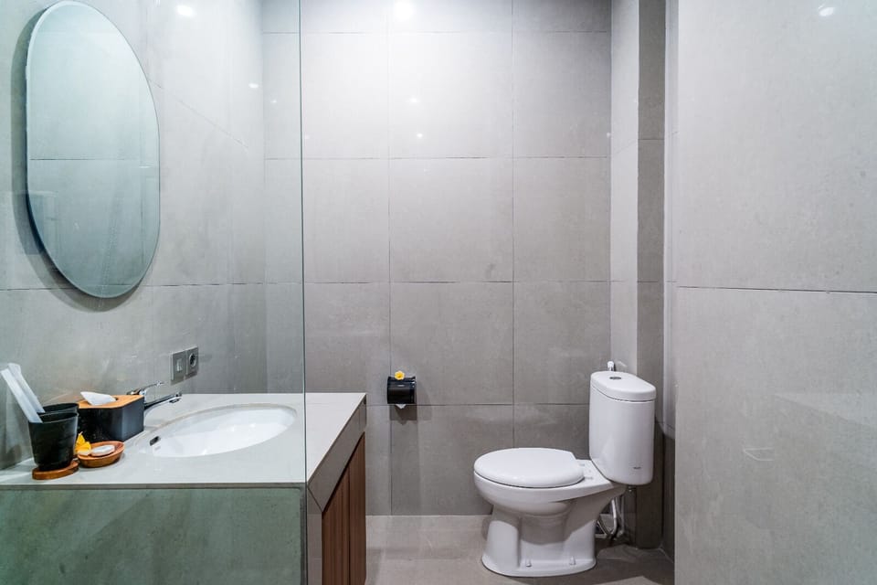 Shower, hair dryer, slippers, towels