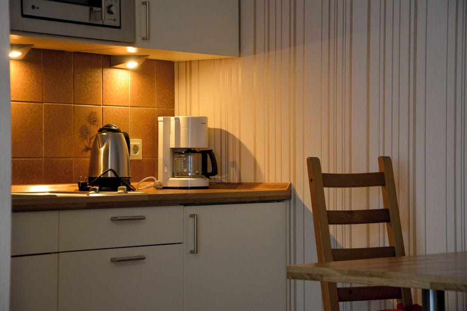 Classic Apartment, Garden View | Private kitchen | Highchair