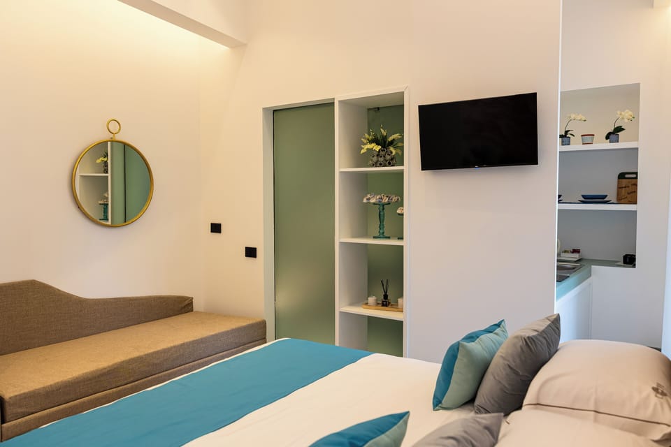 Superior Triple Room, Balcony, City View | In-room safe, desk, laptop workspace, blackout drapes