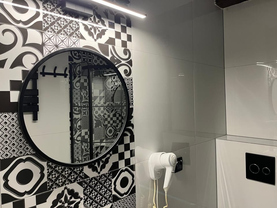 Apartment, Garden View | Bathroom | Shower, hair dryer, towels, toilet paper
