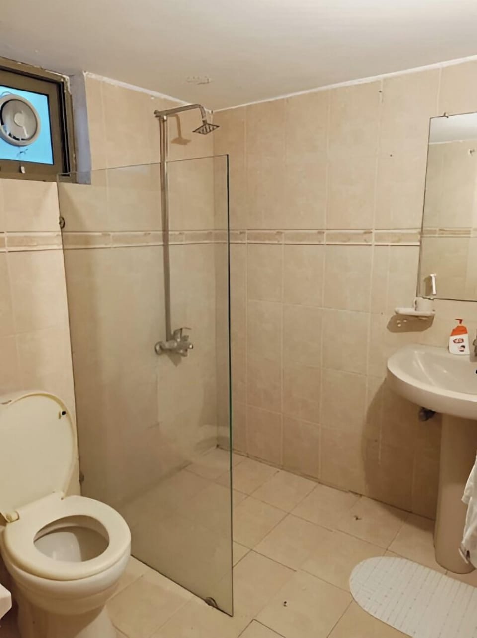 Bathtub, towels, soap, toilet paper