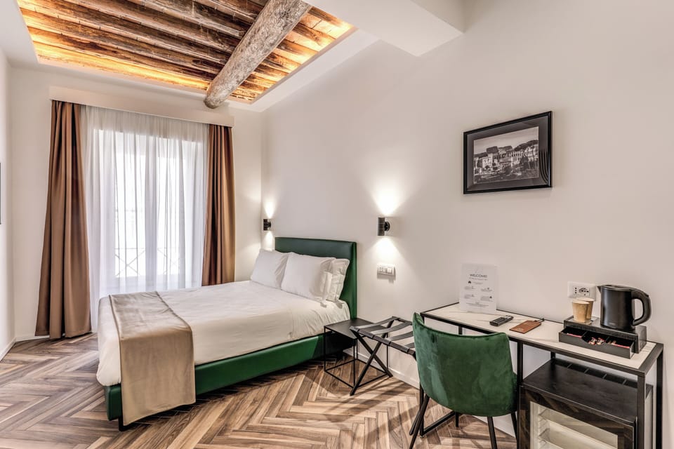 Deluxe Room, City View | In-room safe, desk, laptop workspace, blackout drapes
