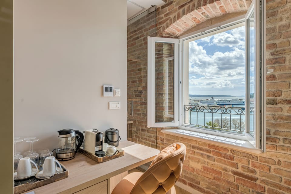 Deluxe Double Room, Sea View | Minibar, in-room safe, desk, laptop workspace