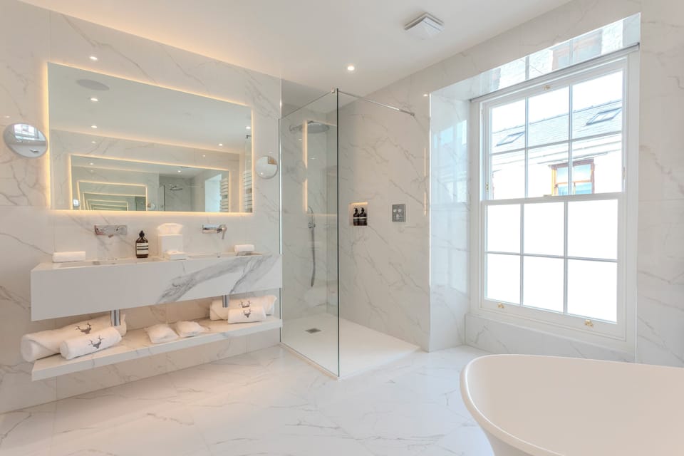 Luxury Double Room, 1 King Bed | Bathroom | Designer toiletries, hair dryer, bathrobes, heated floors