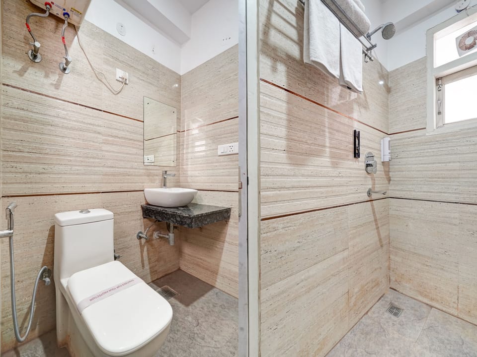 Combined shower/tub, slippers, towels, soap
