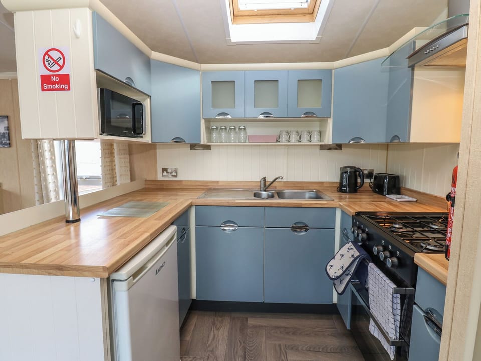 Fridge, microwave, toaster, cookware/dishes/utensils