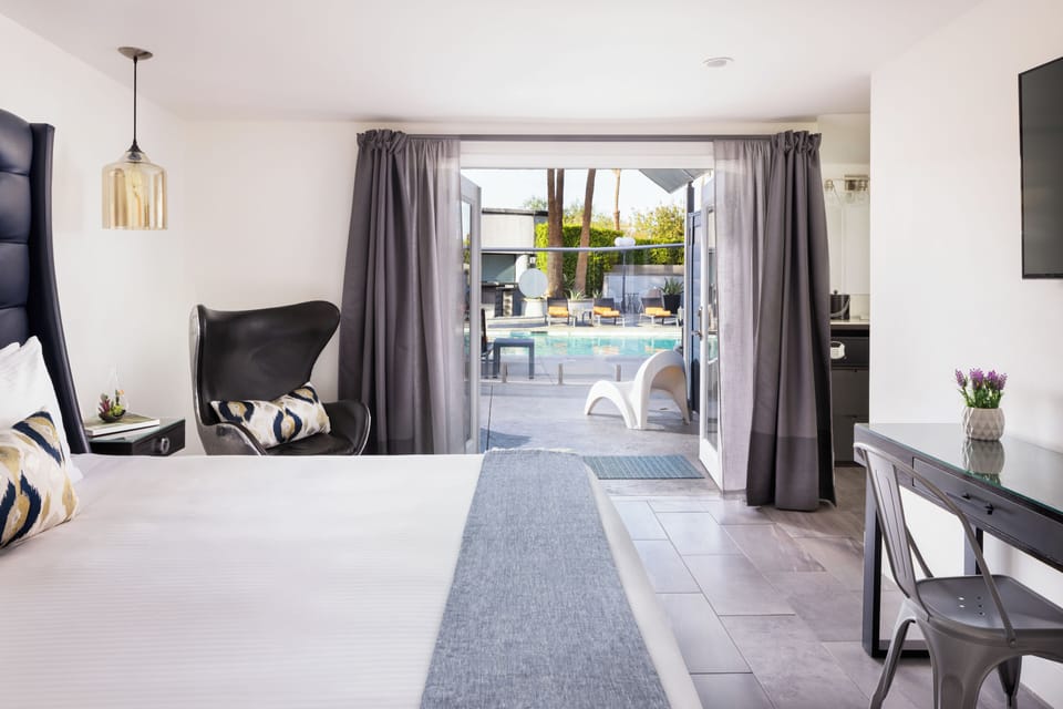 Deluxe Room, 1 King Bed, Pool View | Pillowtop beds, in-room safe, desk, blackout drapes