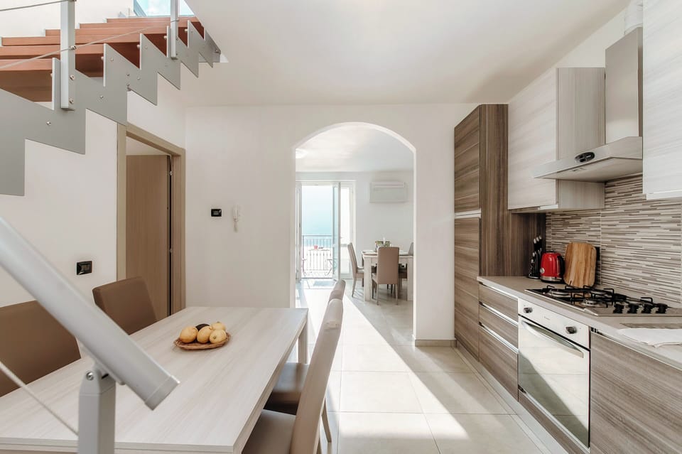 Apartment, Balcony | Private kitchen | Full-size fridge, microwave, oven, stovetop