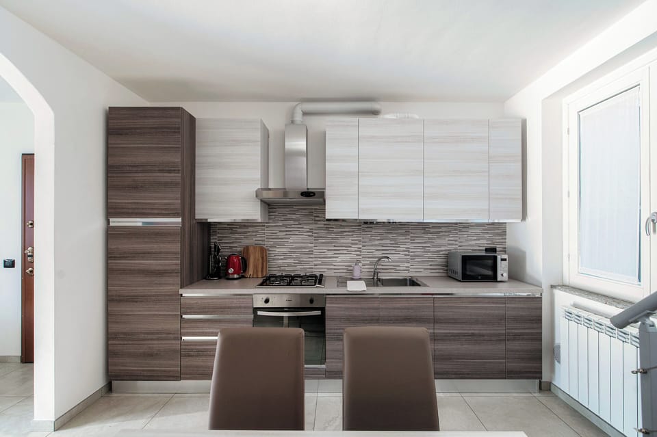 Apartment, Balcony | Private kitchen | Full-size fridge, microwave, oven, stovetop
