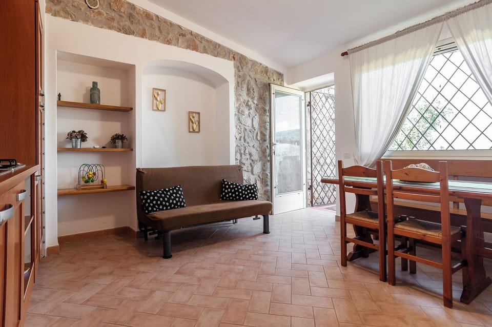 Apartment, Garden View | Living room | 32-inch flat-screen TV with digital channels