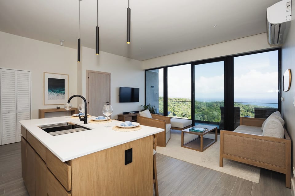 Luxury Apartment, Balcony, Ocean View | Living area | 50-inch Smart TV with cable channels