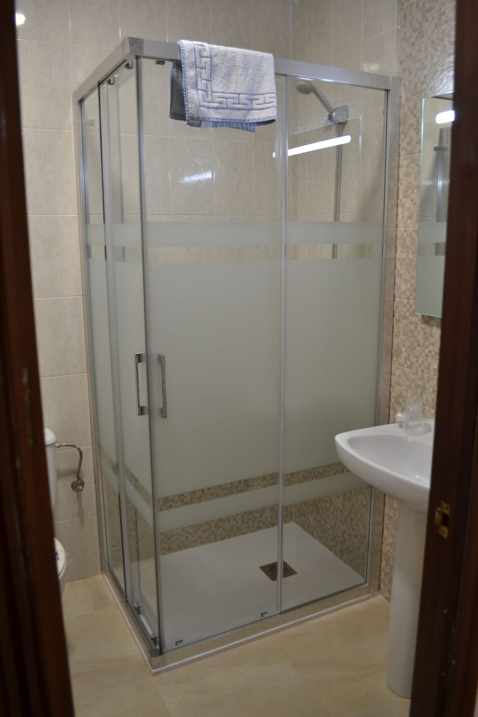 Basic Double Room Single Use, 1 Large Twin Bed, Partial Ocean View | Bathroom | Shower, hair dryer, towels, soap