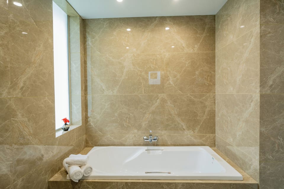 Deluxe Room, Balcony, City View | Bathroom | Shower, free toiletries, toilet paper