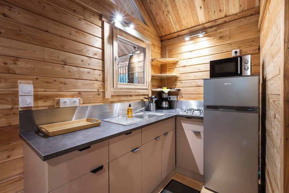 Family Chalet | Private kitchen | Stovetop, highchair, cookware/dishes/utensils, cleaning supplies