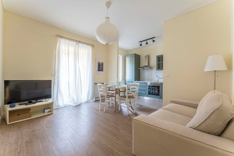 Apartment | Living area | 32-inch flat-screen TV with cable channels