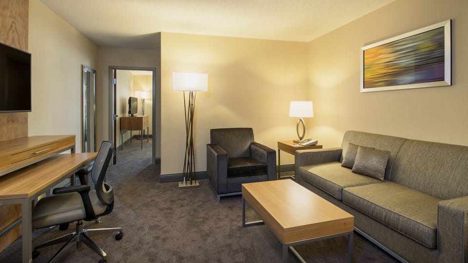 Suite, 1 Queen Bed (Additional Living Area) | Desk, laptop workspace, blackout drapes, iron/ironing board