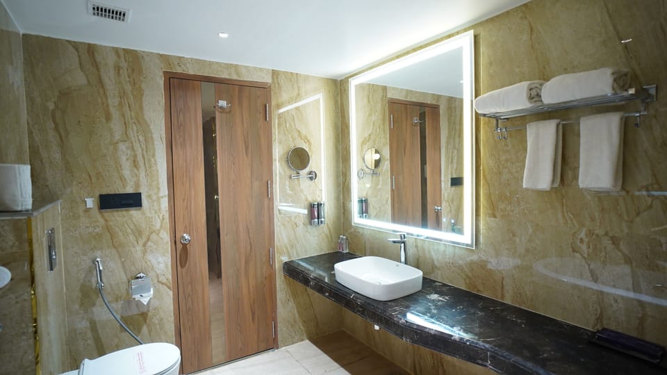 Shower, hair dryer, slippers, towels
