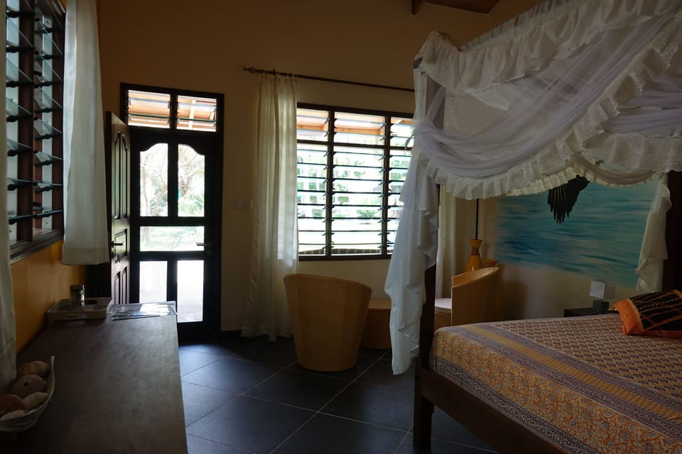 Deluxe Studio Suite, Garden View | In-room safe, desk, laptop workspace, blackout drapes