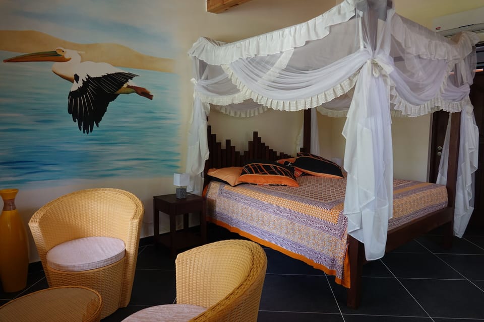 Deluxe Studio Suite, Garden View | In-room safe, desk, laptop workspace, blackout drapes