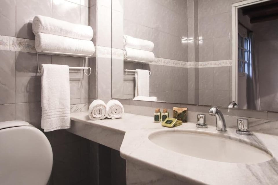 Bathrobes, bidet, towels, toilet paper