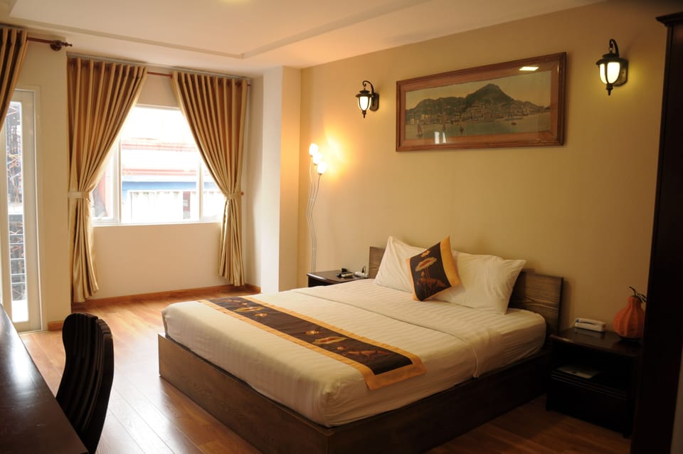 Deluxe Double Room, Balcony, City View | Minibar, in-room safe, laptop workspace, blackout drapes