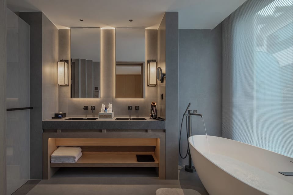 Superior Twin Room, Garden View | Bathroom | Hair dryer, slippers, towels, soap