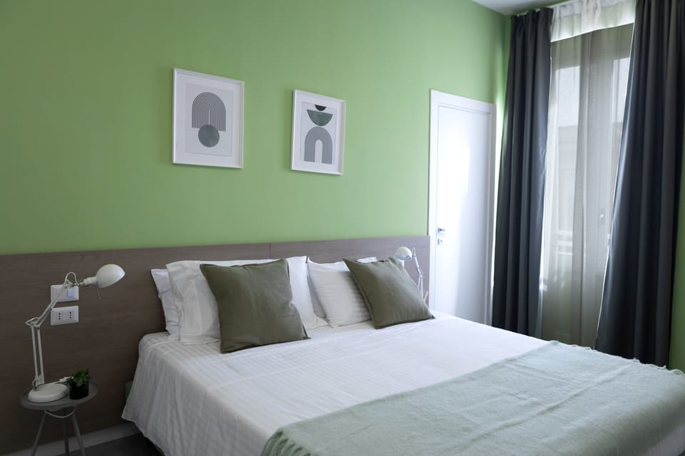 Standard Quadruple Room, City View | Free minibar, in-room safe, individually decorated