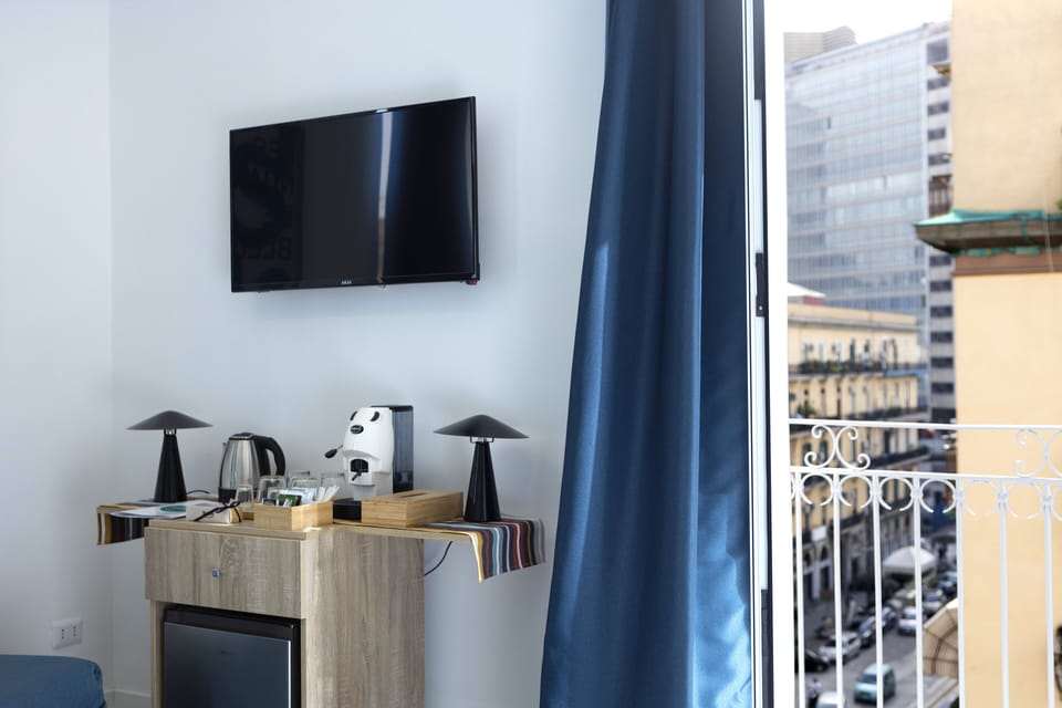 Deluxe Quadruple Room, Balcony, City View | Minibar (free items), in-room safe, blackout drapes, cribs (free)