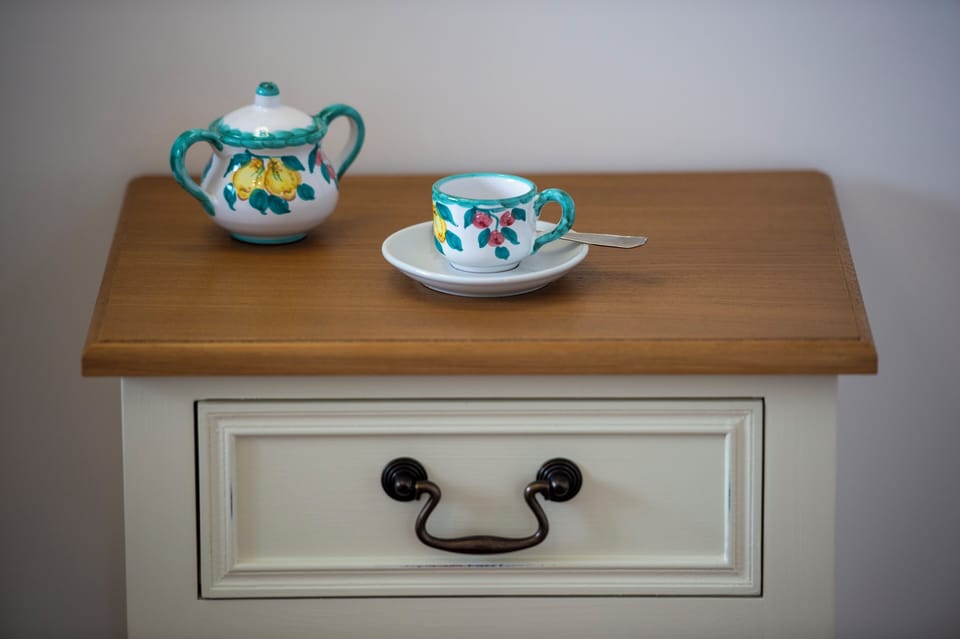 Deluxe Quadruple Room, Sea View | In-room safe, desk, laptop workspace, blackout drapes